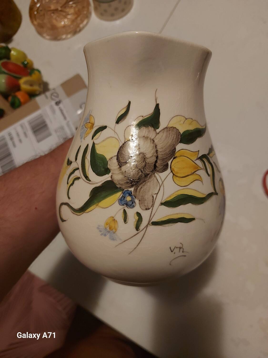 Earthenware pitcher with floral motifs in the Moustiers style, signed.