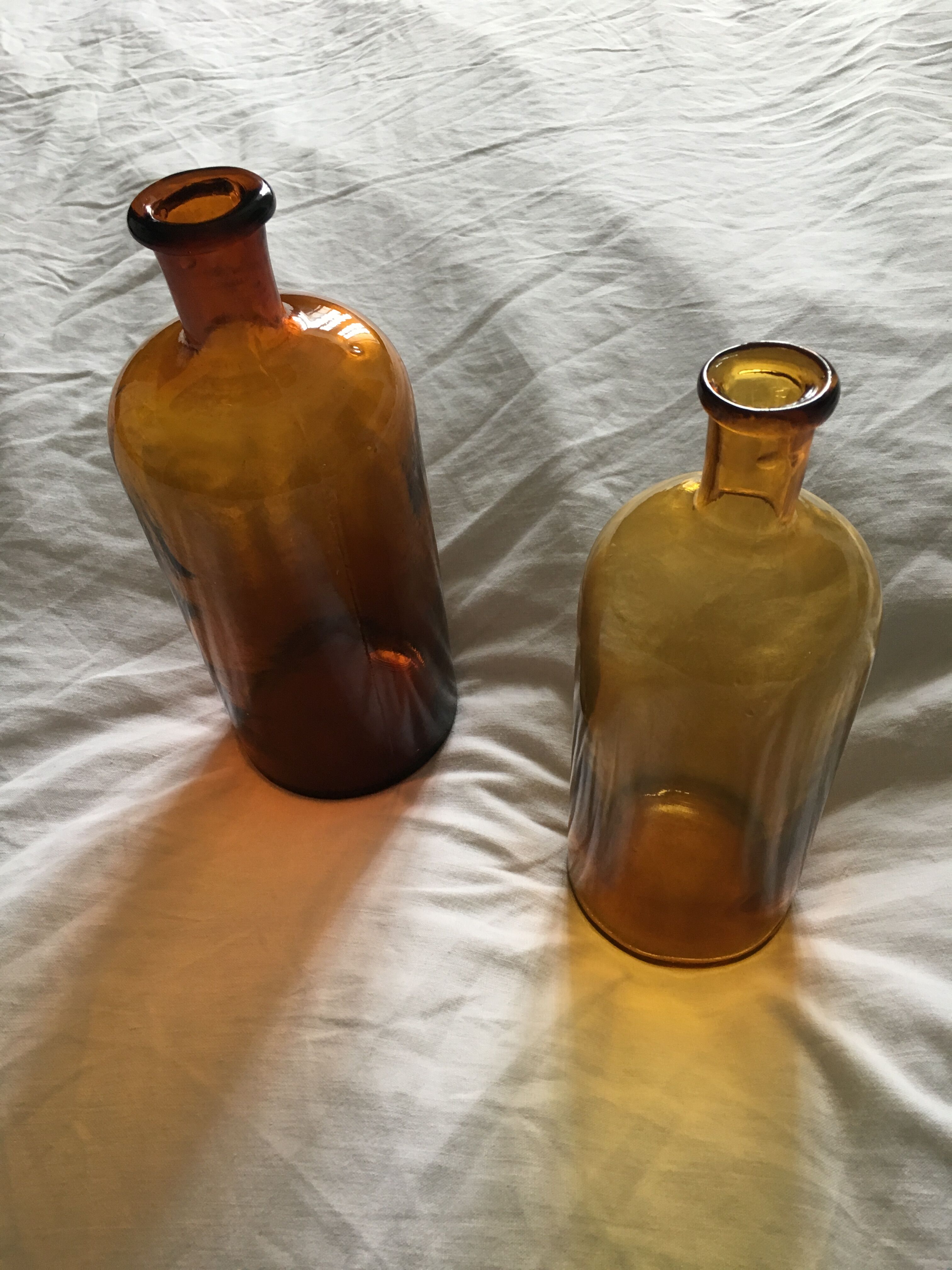 Duo of amber apothecary bottles
