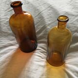 Duo of amber apothecary bottles