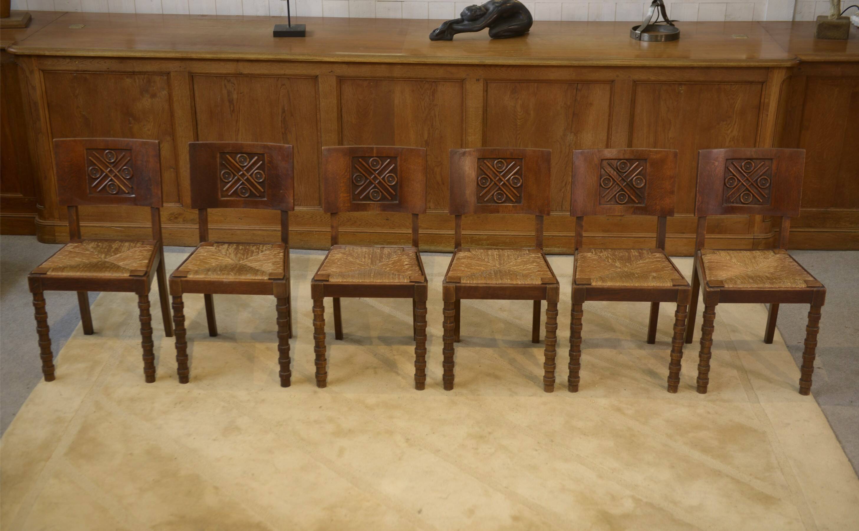 Ensemble de 6 chaises Charles Dudouyt en chêne 1950’s