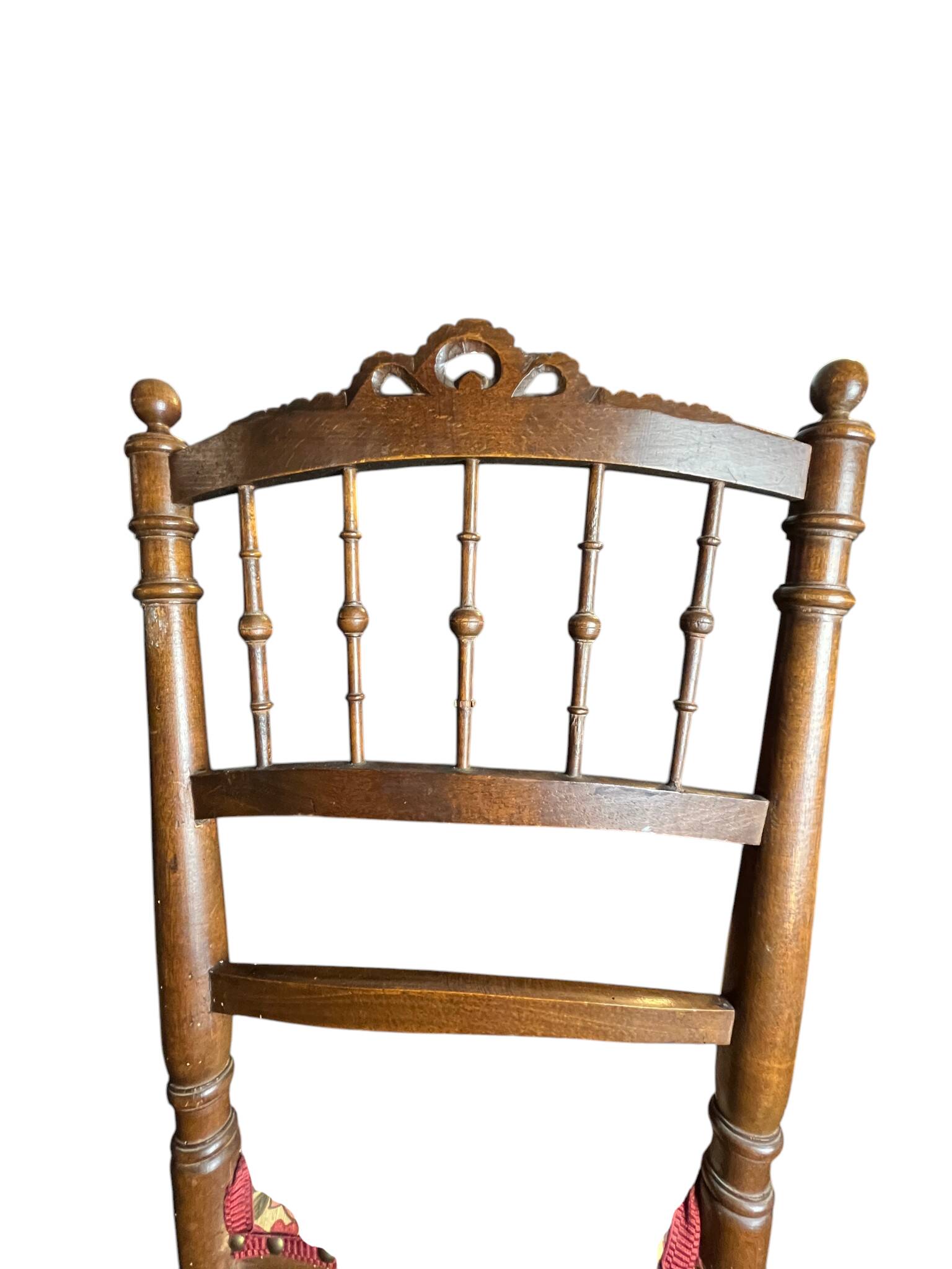 Two floral upholstered music chairs from the early 20th century.