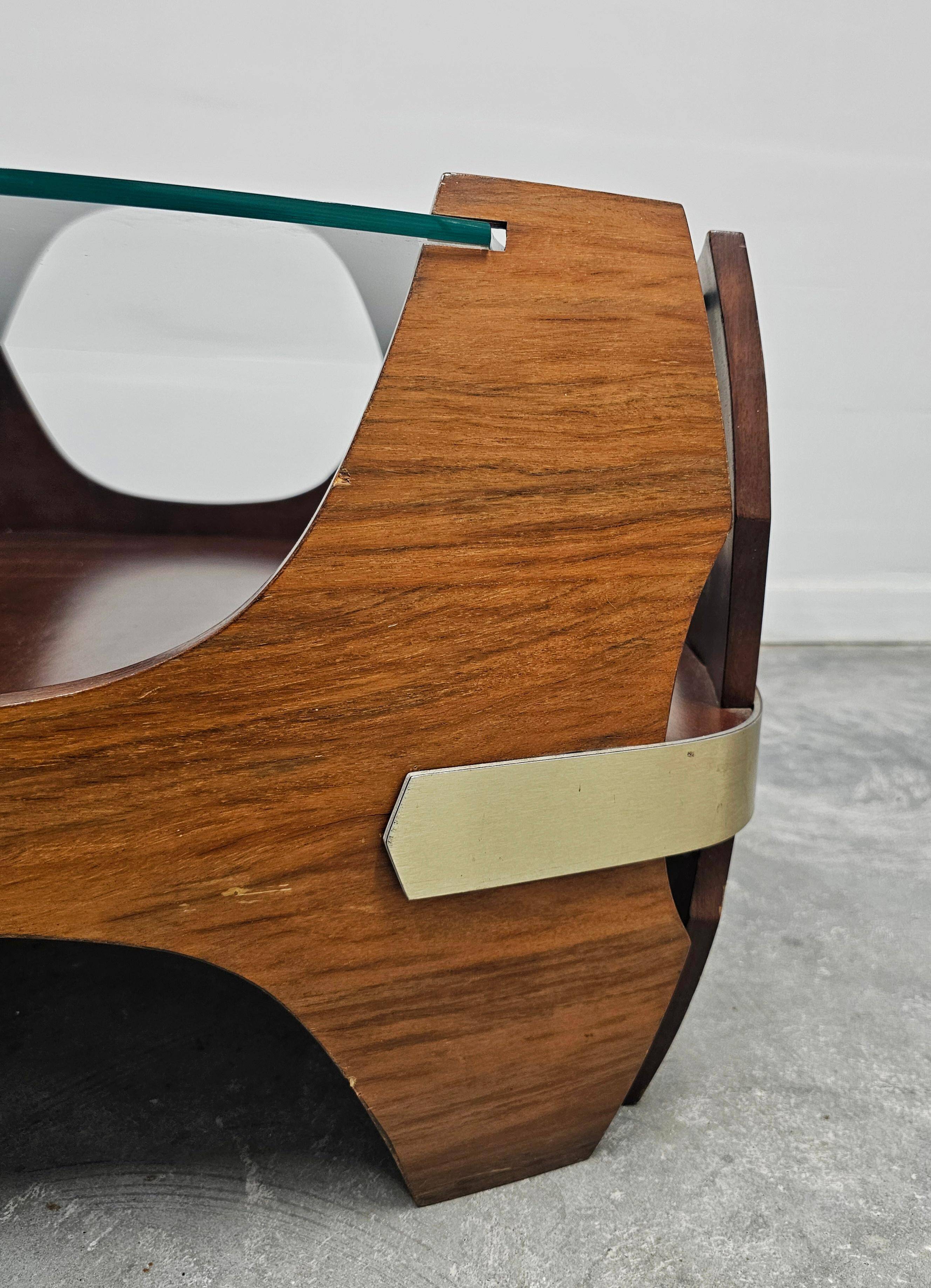Mid-century coffee table in curved plywood with a glass top, 1940s.