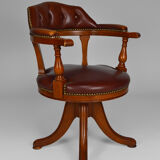 Swivel Chesterfield armchair in wood and leather