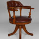 Swivel Chesterfield armchair in wood and leather