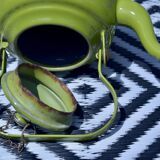 Vintage green enameled sheet metal kettle