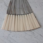Set of 12 knives in stainless steel and bakelite "Yanid" years 60-70