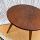 Pretty little vintage round table with tapered legs.