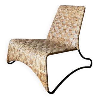 Woven rattan armchair