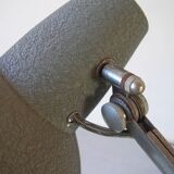 Super Chrome old articulated metal desk lamp on workshop decor base