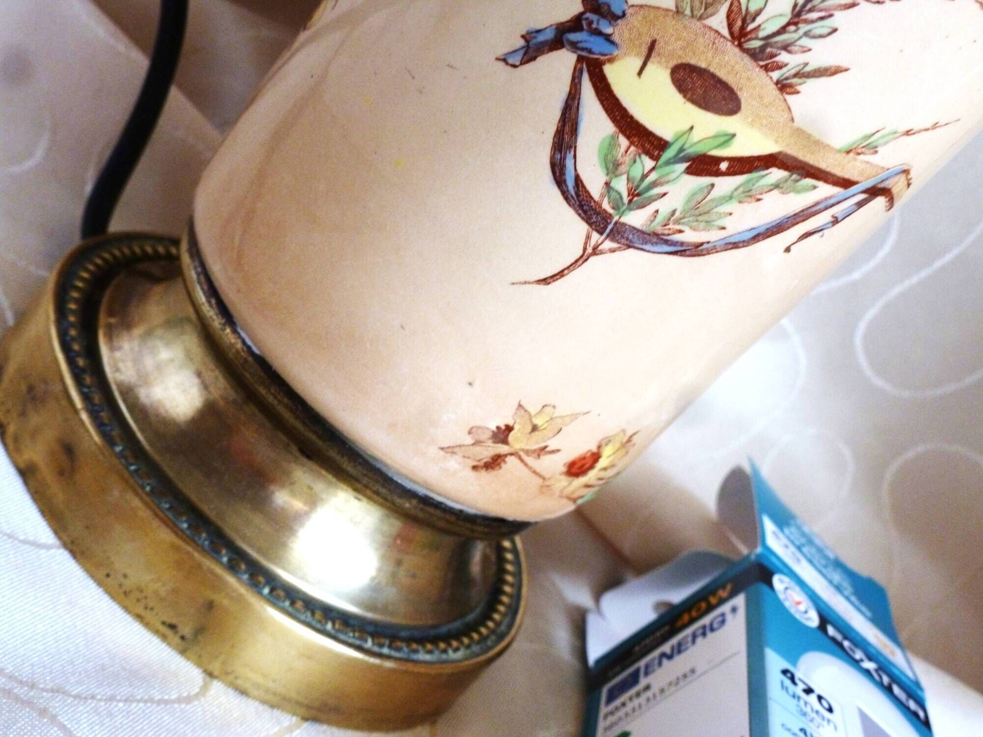 Old ceramic lamp "Lunéville" with a pig bladder shade.