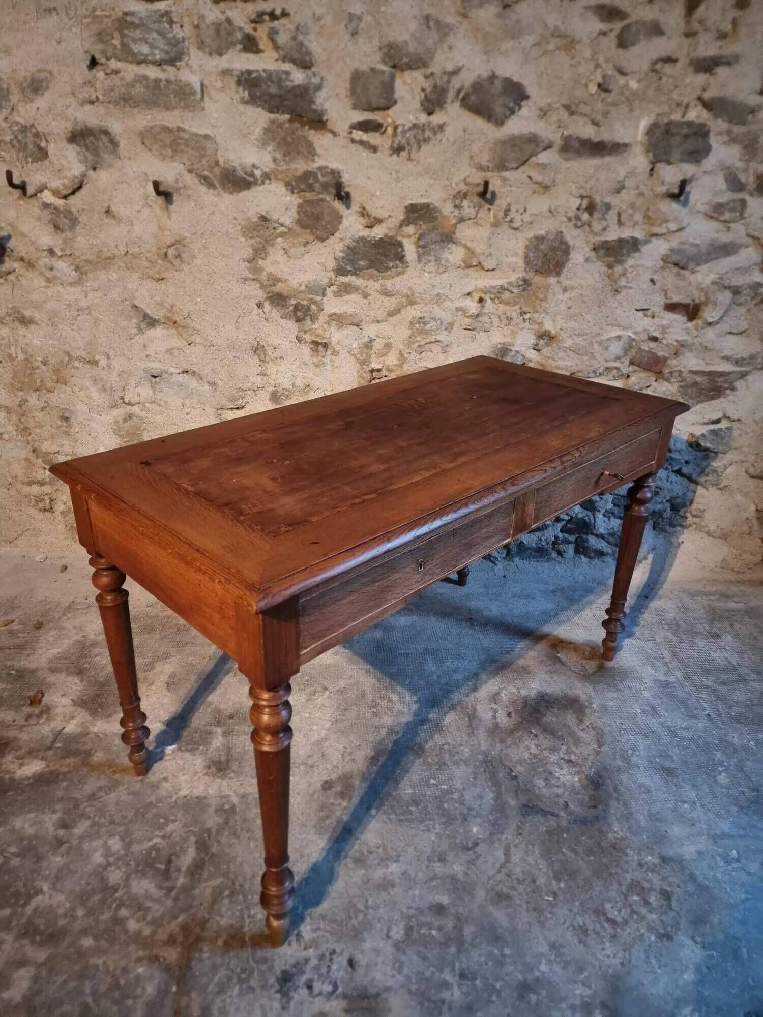 Antique French writing desk in oak with two drawers, 1920s.