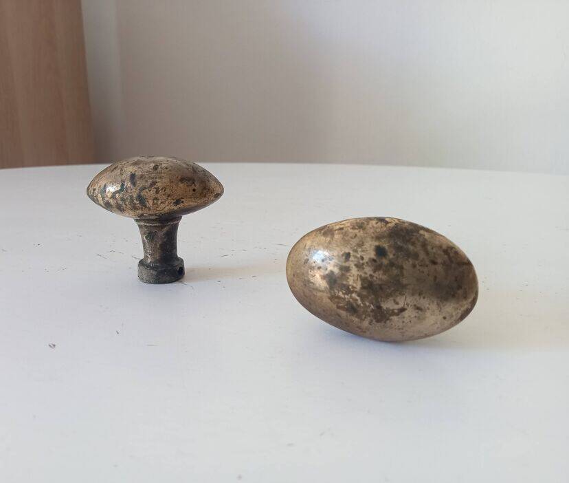 Pair of antique oval door handles in solid gold-plated brass.