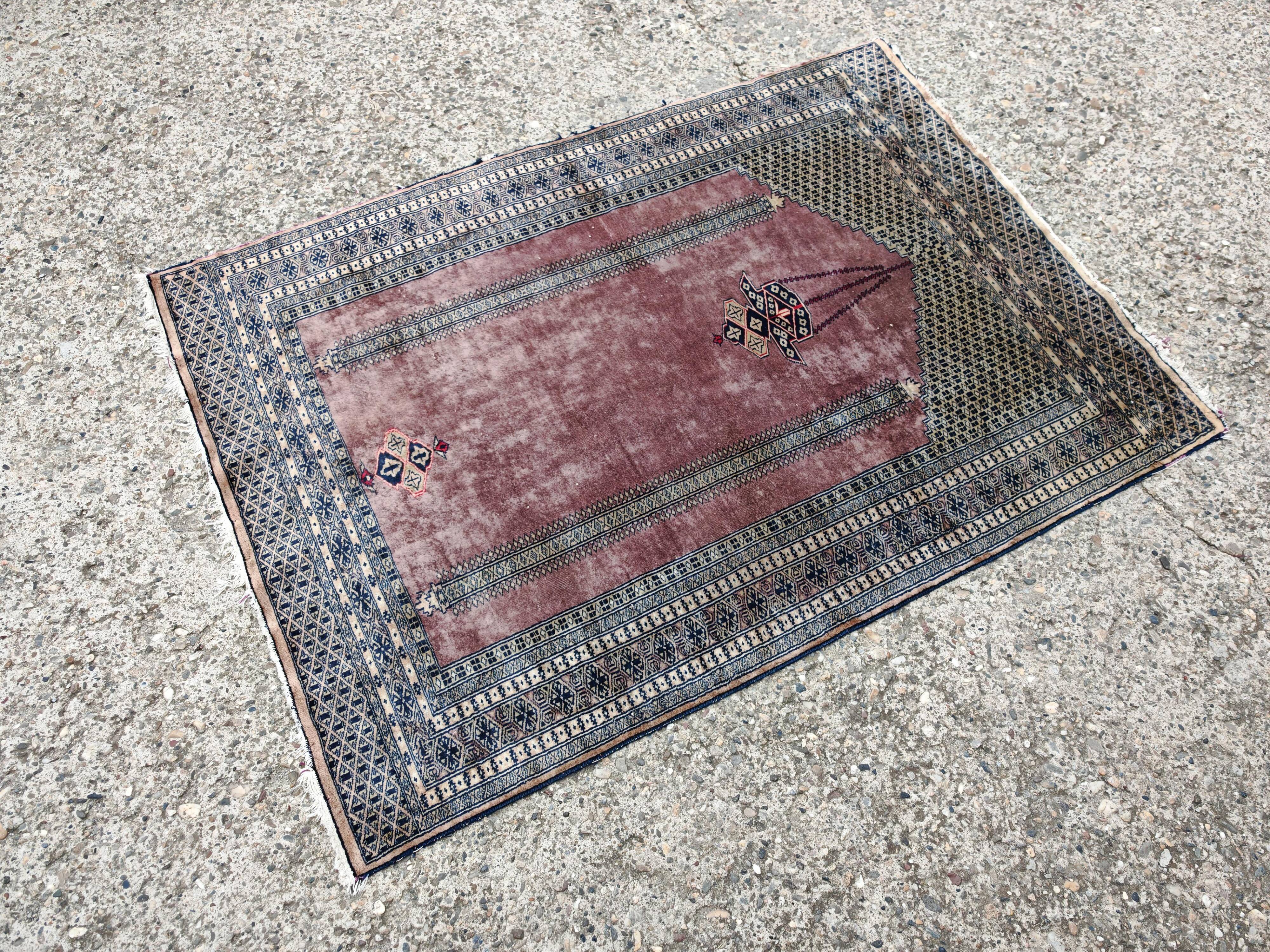 Vintage Anatolian prayer rug made of hand-knotted wool.