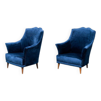 Paire de fauteuils en velours bleu