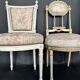 Antique Louis XVI style chair with patinated wood and floral fabric.