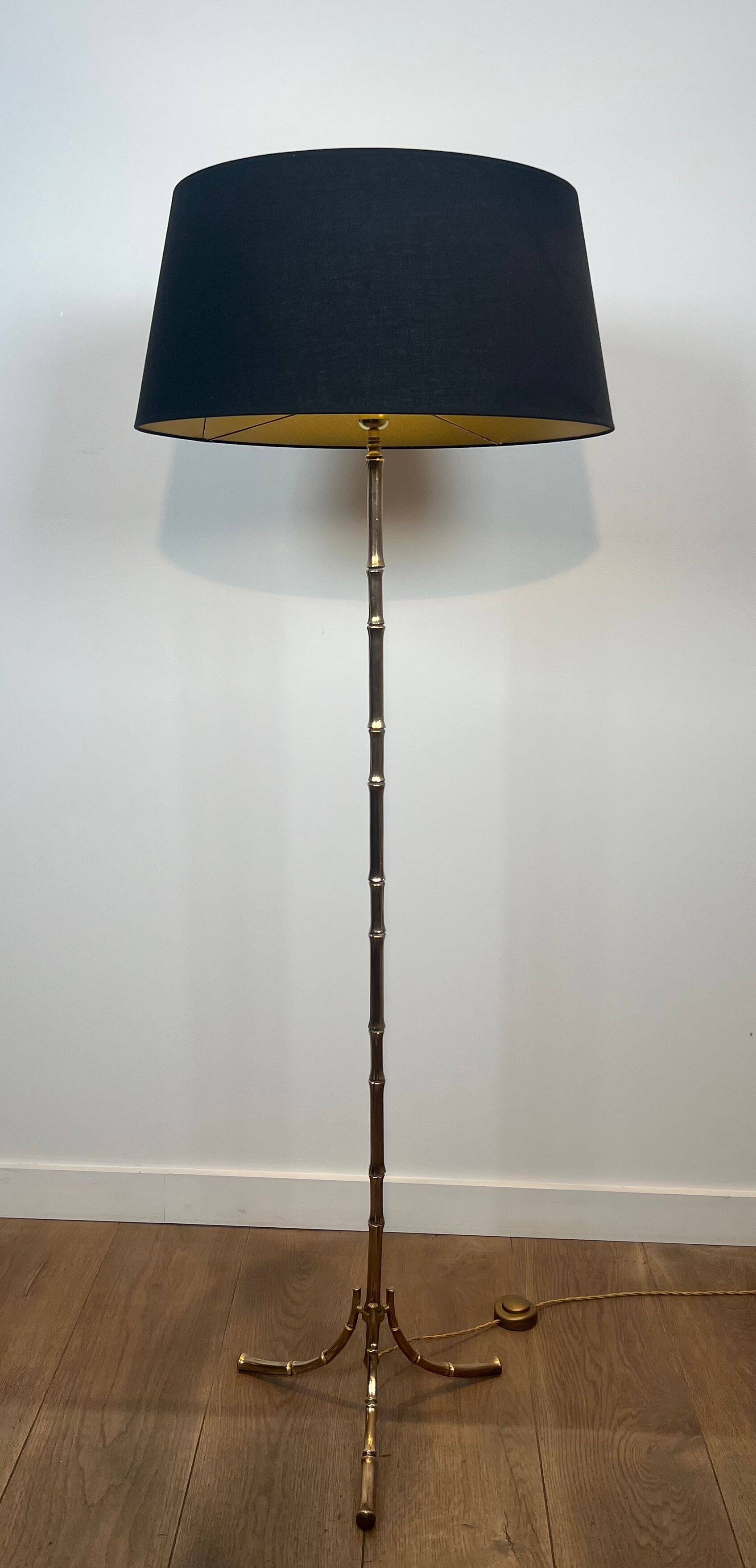 Bronze floor lamp in faux-bamboo style by Maison Baguès.