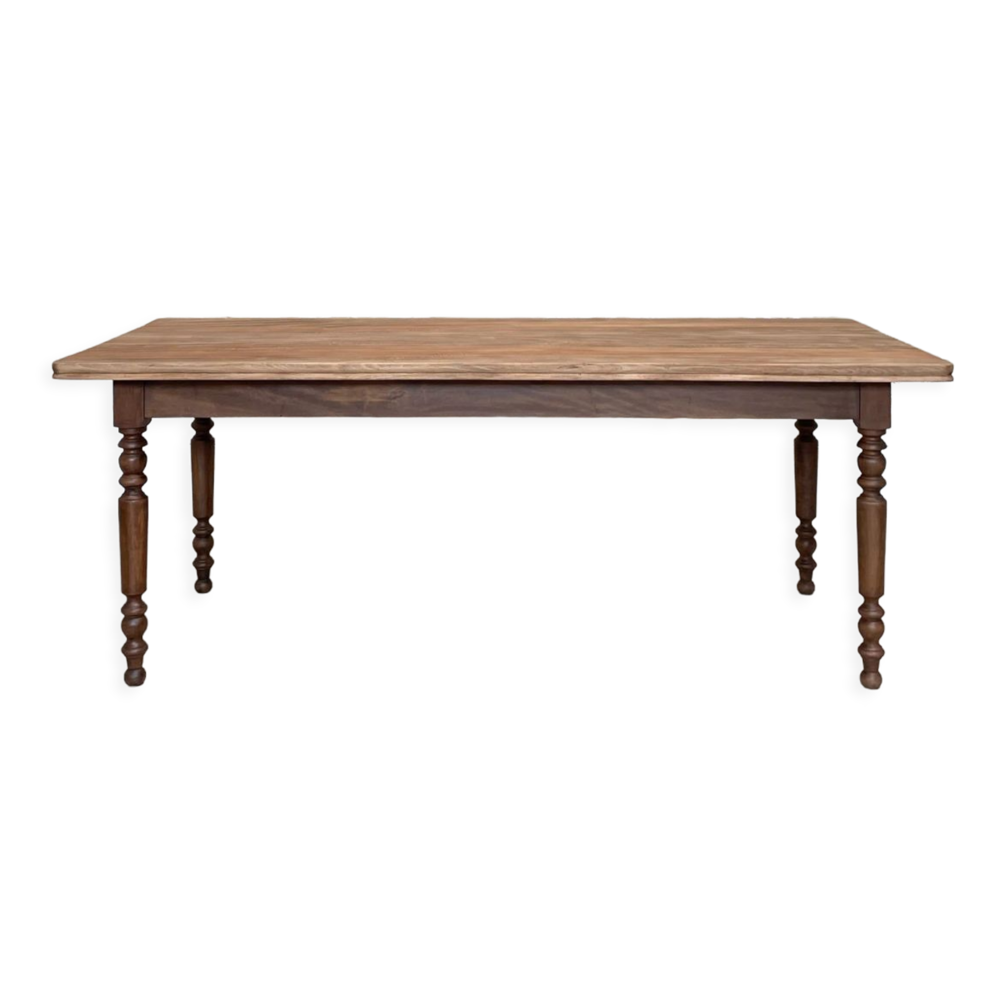 Vintage farmhouse table with turned legs.