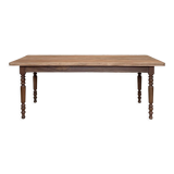 Vintage farmhouse table with turned legs.