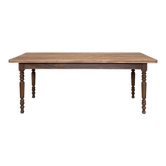 Vintage farmhouse table with turned legs.