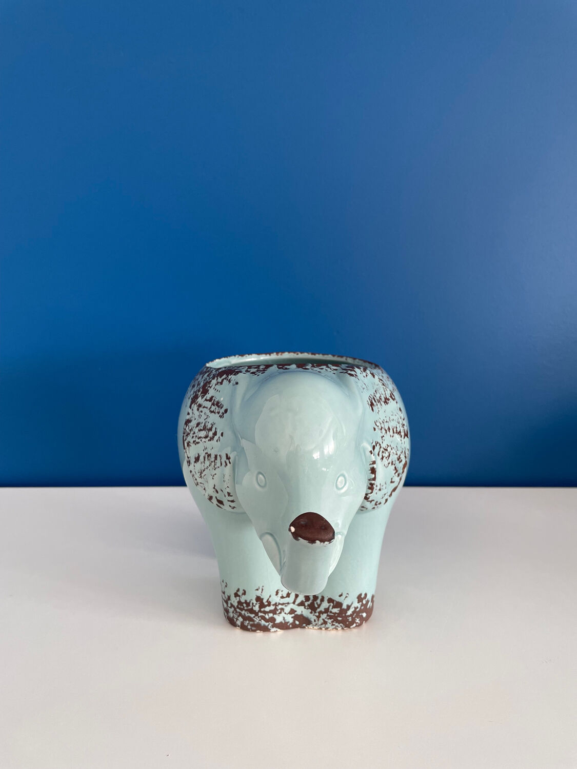 Enamelled elephant pot cover