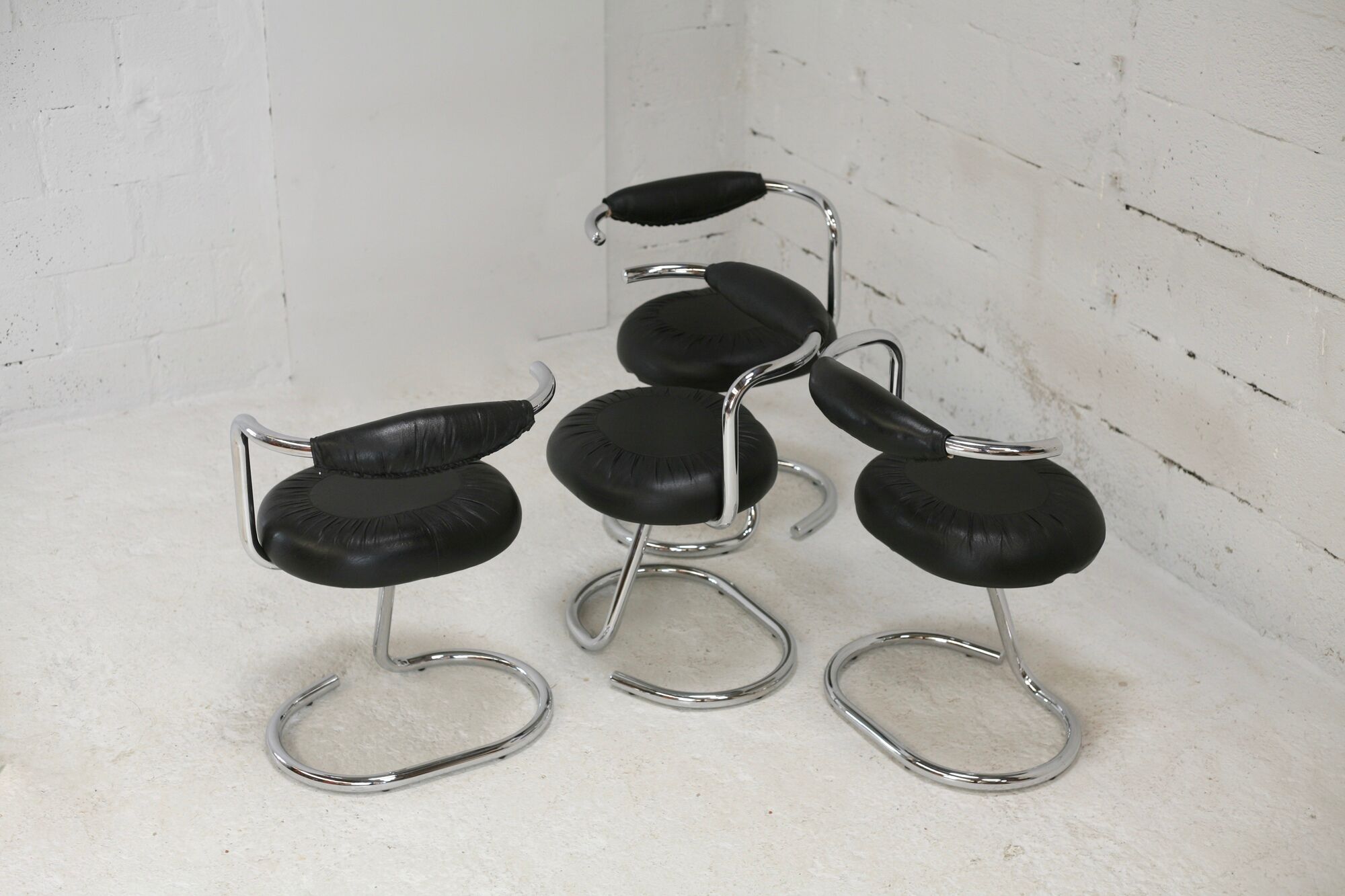 4 chairs tubular steel, imitation black leather, Italy, circa 1970
