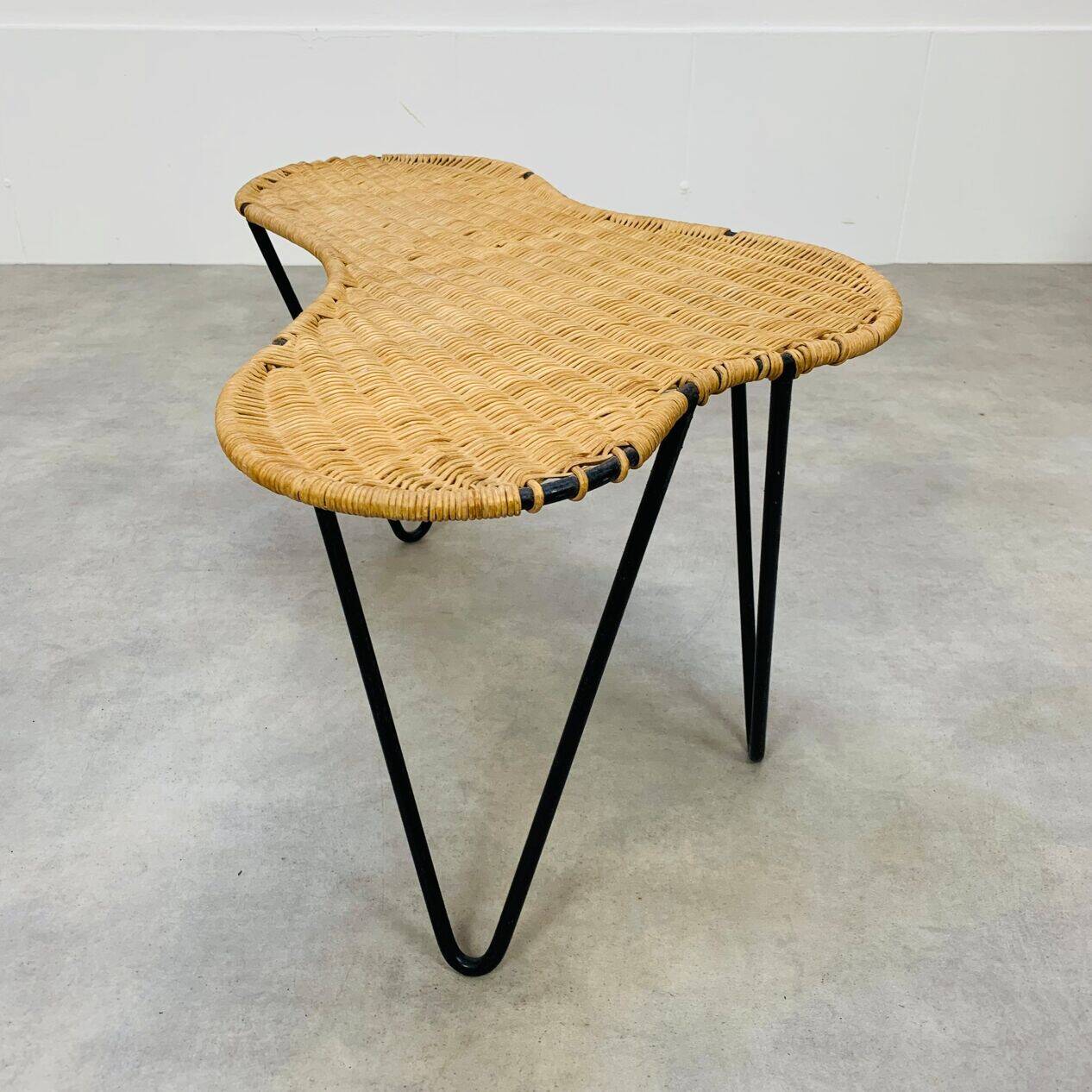 Raoul Guys coffee table, free form, wicker and metal, 1960s.