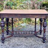 Table from the late 19th century, neo-Renaissance style, in black and oak.