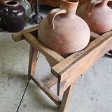 Old wooden jar holder with 3 clay jars