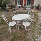 Garden furniture in wrought iron of the 70s. 5 pieces, oval table.