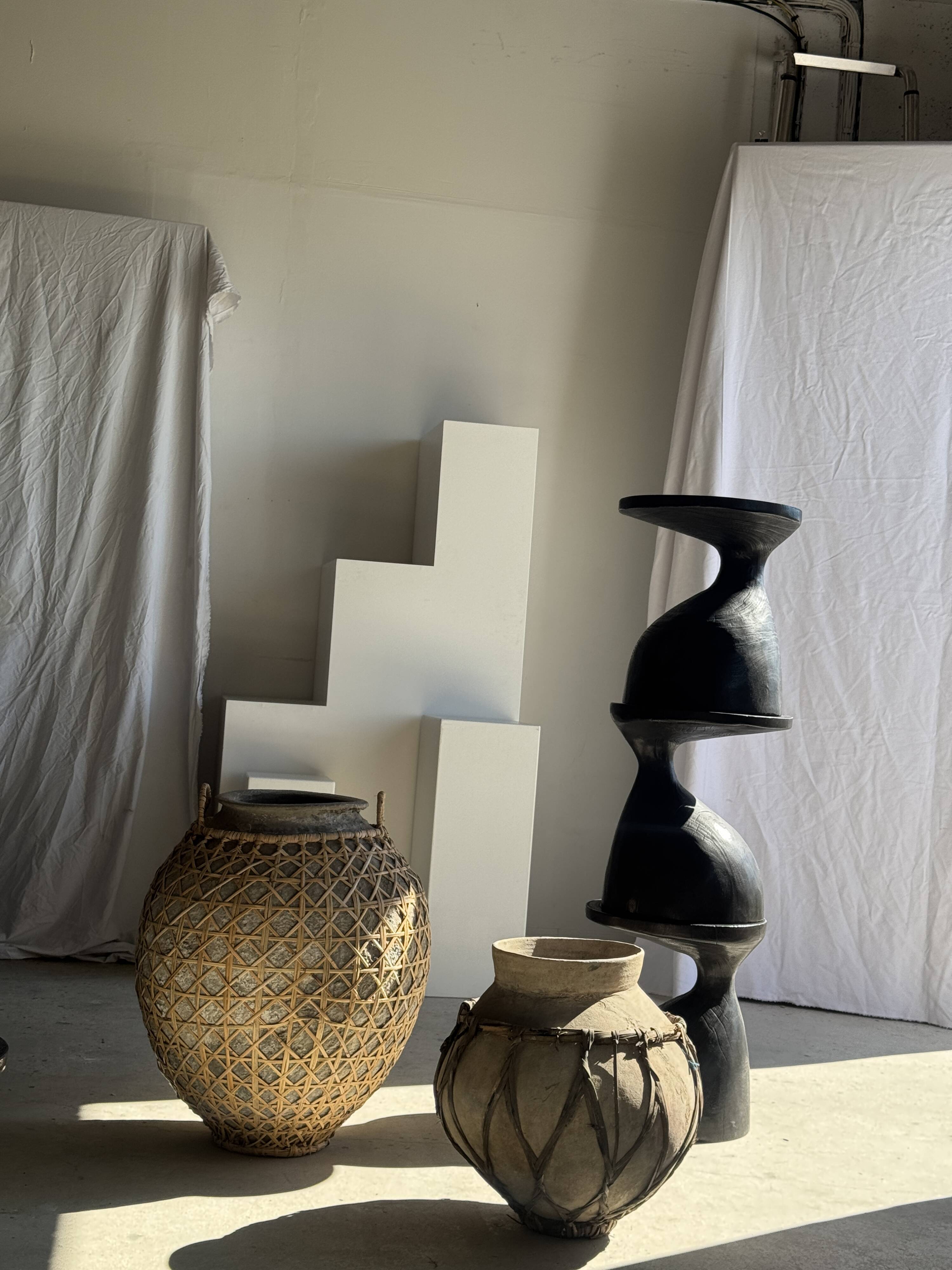 Immense light grey antique-style pot with a crosshatch lid and handles.