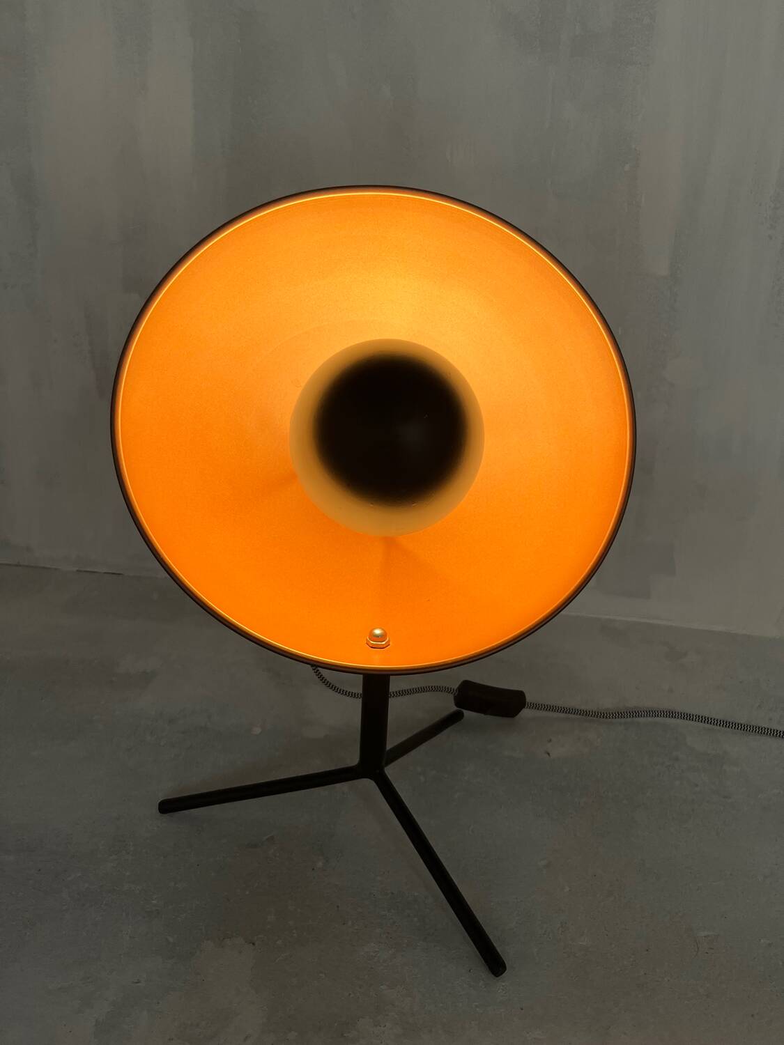 Vintage industrial lamp with a metal frame.