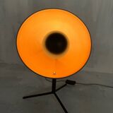 Vintage industrial lamp with a metal frame.