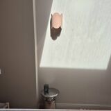 Mocha enamelled stoneware wall light (small model).