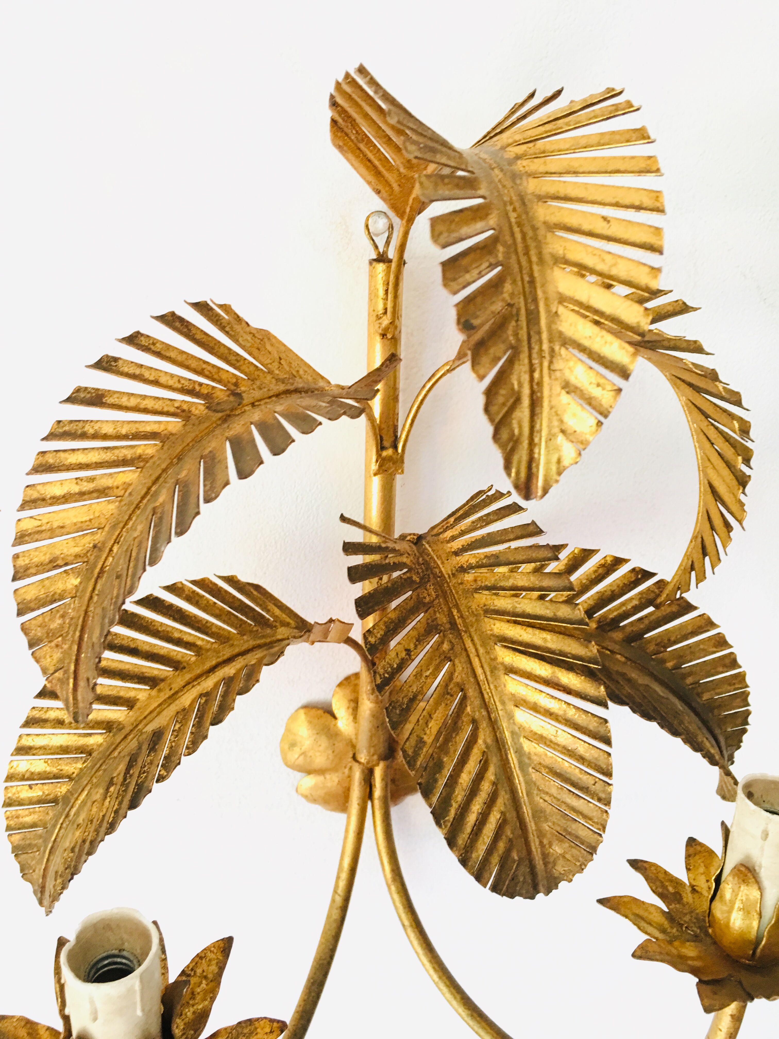 Golden palm leaf sconce