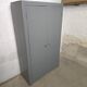 Curved wardrobe workshop locker made of wood repainted in grey.