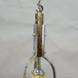 Antique Art Deco chandelier with three glass lampshades.