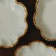 Set of eight small bread plates in white Limoges porcelain