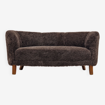 60s, Danish design, renovated 2 seater "Banana" sofa, genuine sheepskin.