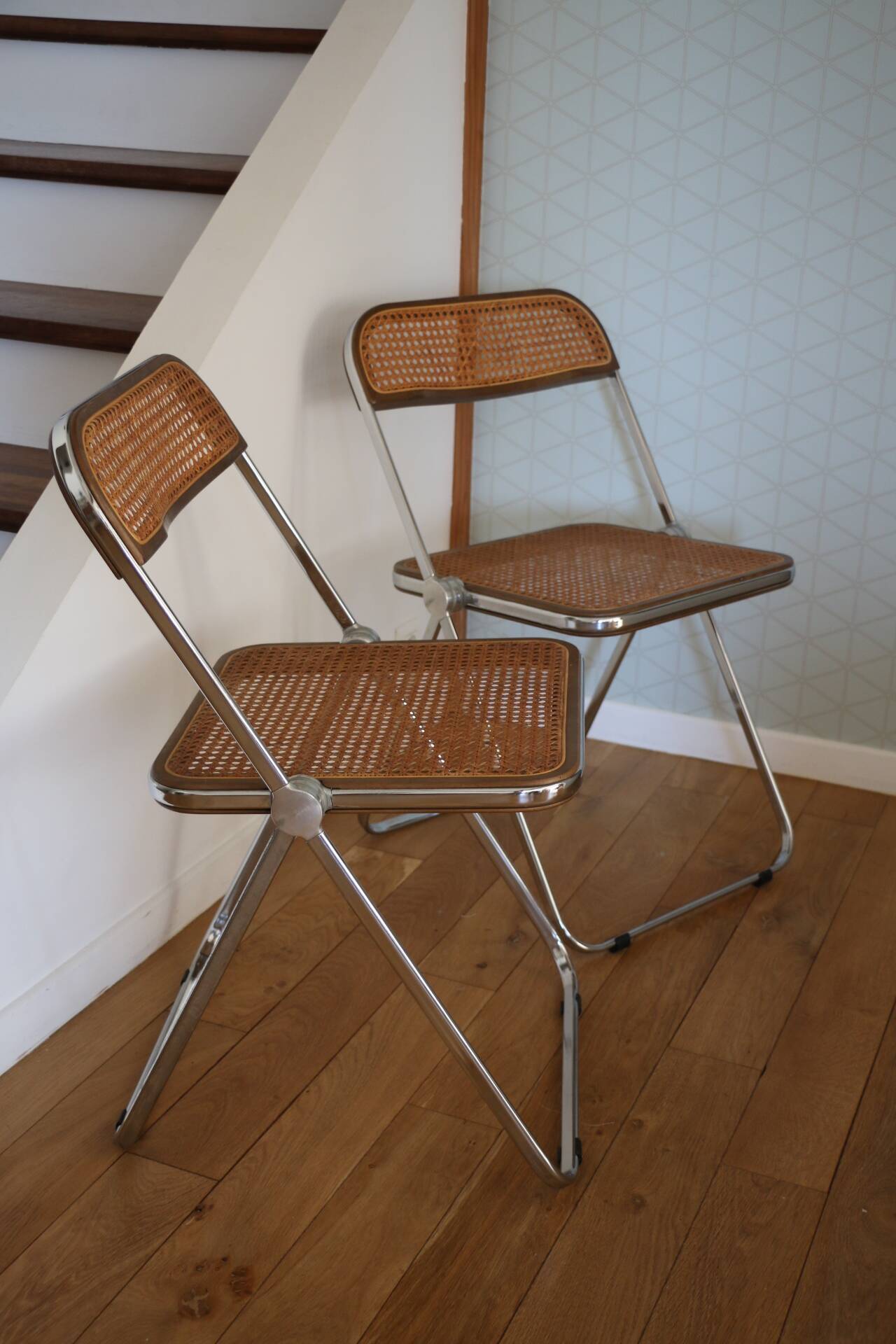 2 plia rattan chairs by piretti