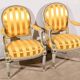 Pair of Cabriolet Armchairs, in rechampi wood, Louis XVI style – Late 19th century