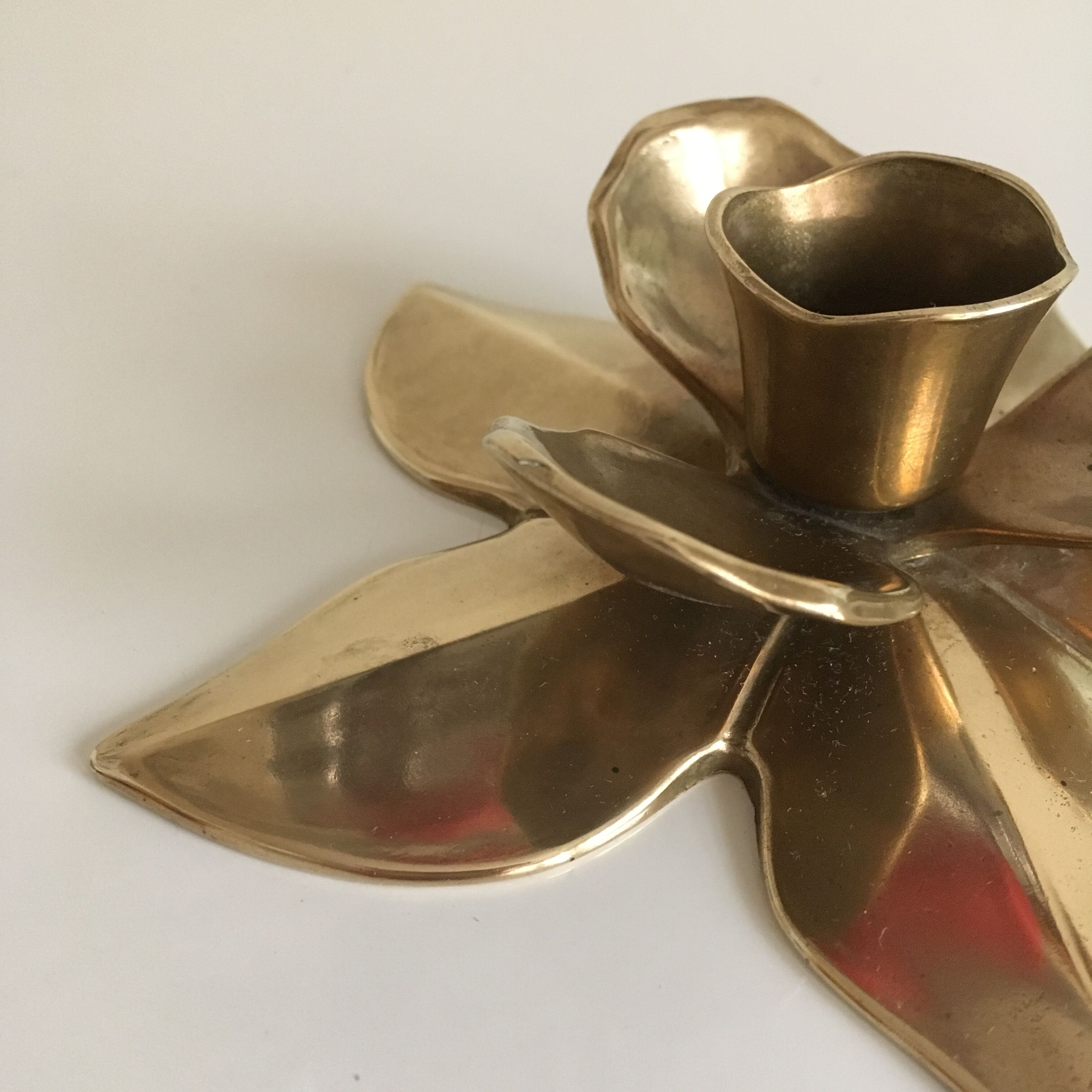 Flower-shaped brass candleholder