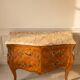 Louis XV style commode with marquetry and marble.