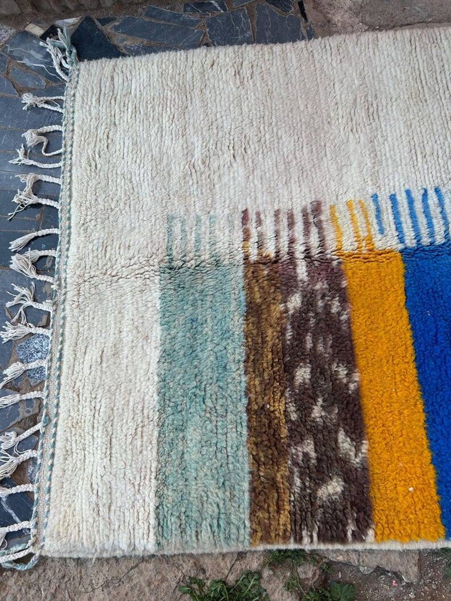 Handmade traditional pure wool rug with colourful patterns.