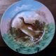 3 decorative porcelain plates from Limoges featuring partridges and pheasants.
