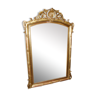 Golden mirror with Louis XV-style shell pediment at the end of the 19th century