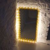 Large luminous acrylic mirror.