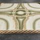 Ceramic tile trivet with vintage pattern woven wicker outline
