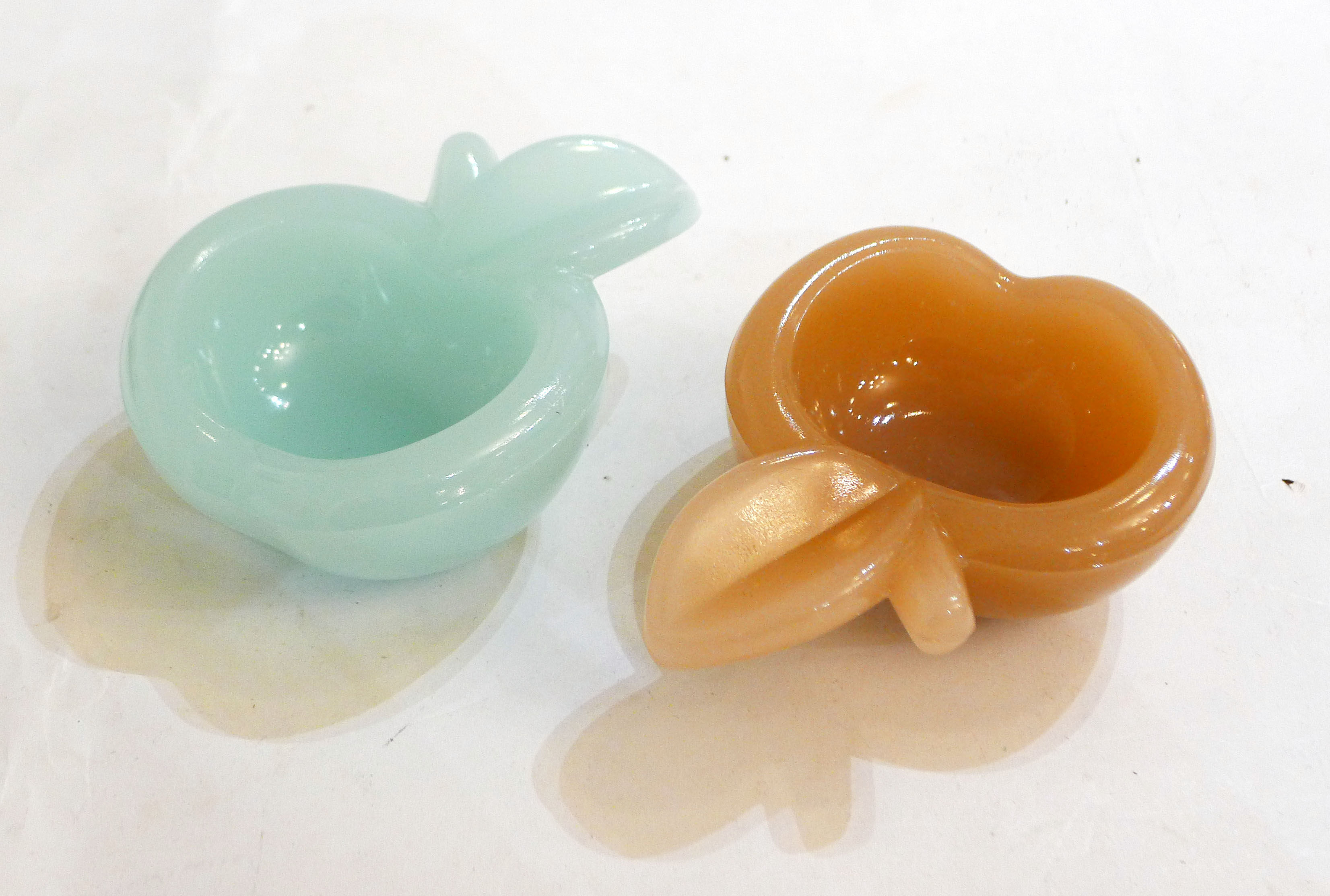Pair of Apple opalin ashtrays