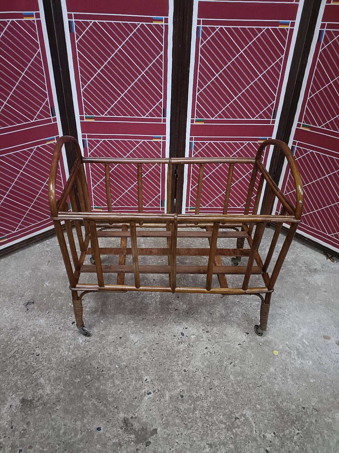 Old small bed or cradle for baby in vintage rattan