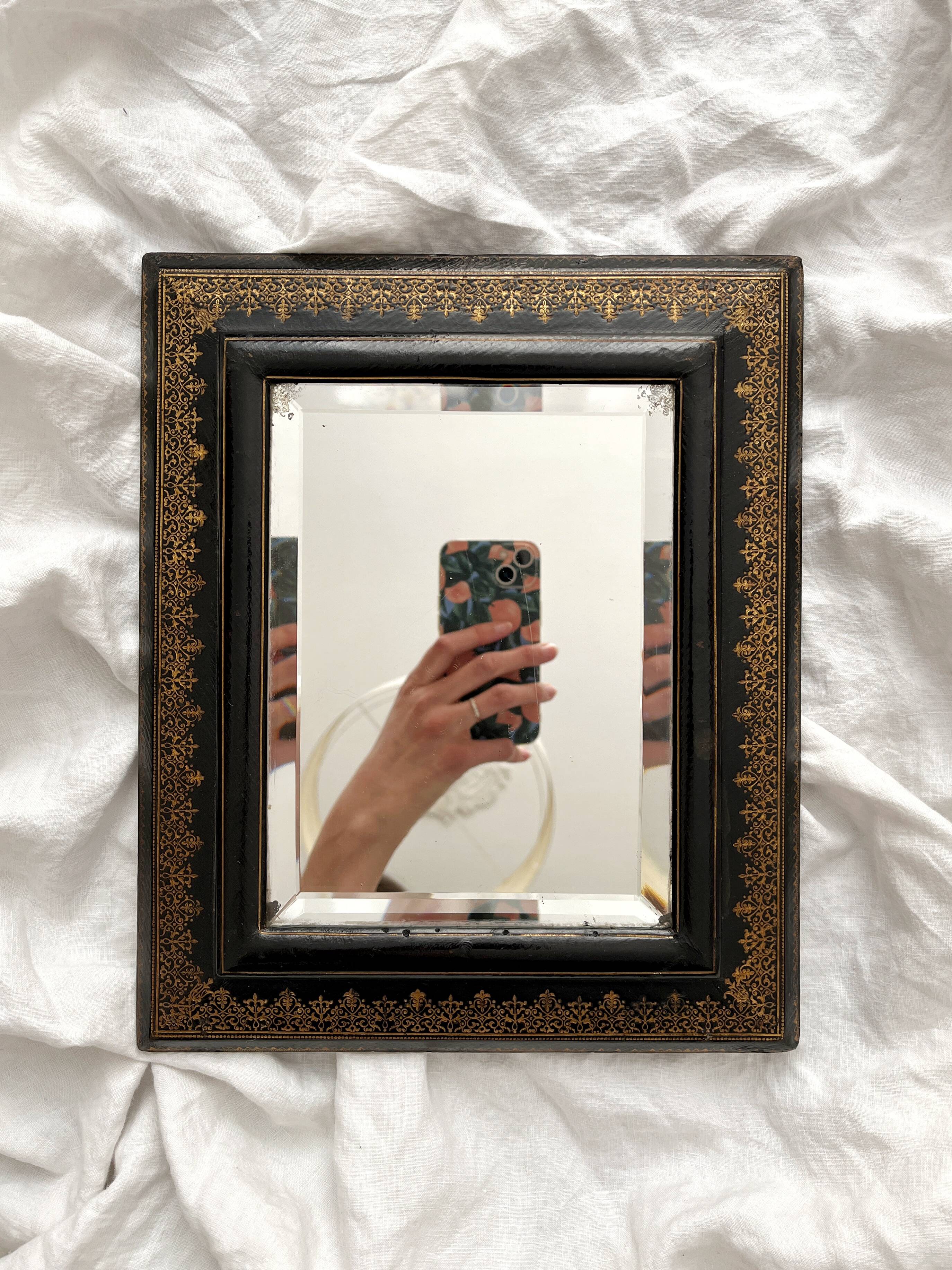Old beveled mirror with black and gold leather binding Napoleon III